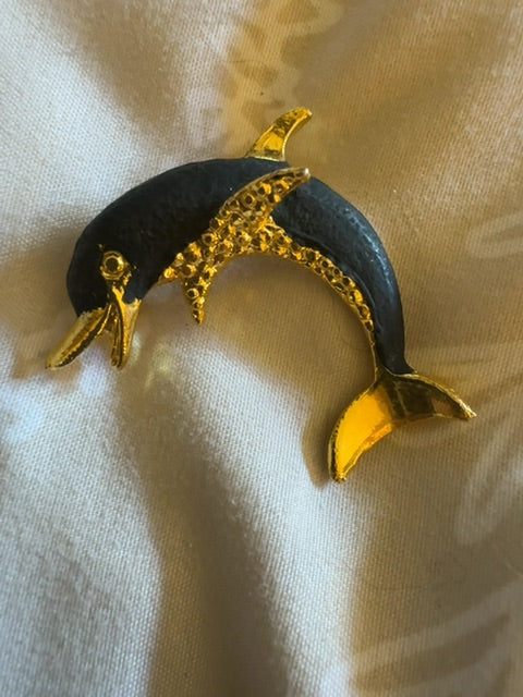 Black dolphin brooch