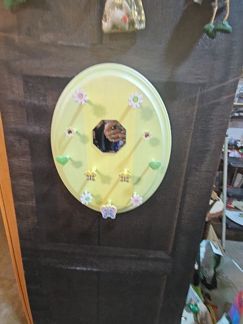 Yellow hanger with mirror