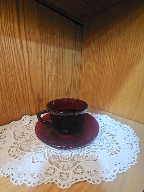 red  Red glass cup and saucer