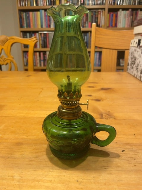 Small green oil lamp with leaf and fruit design
