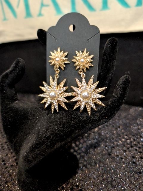 Gold tone starburst Earrings