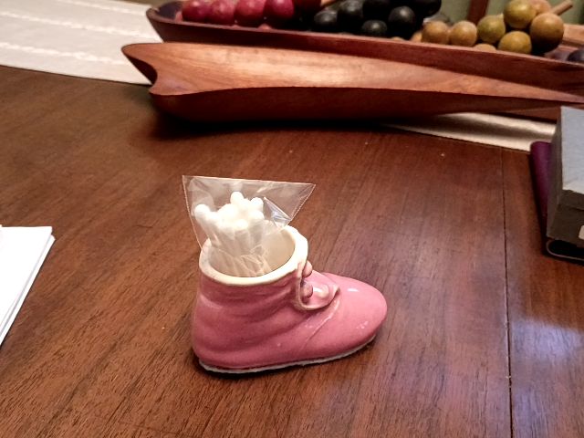 Vintage pink ceramic baby shoe Q tip holder