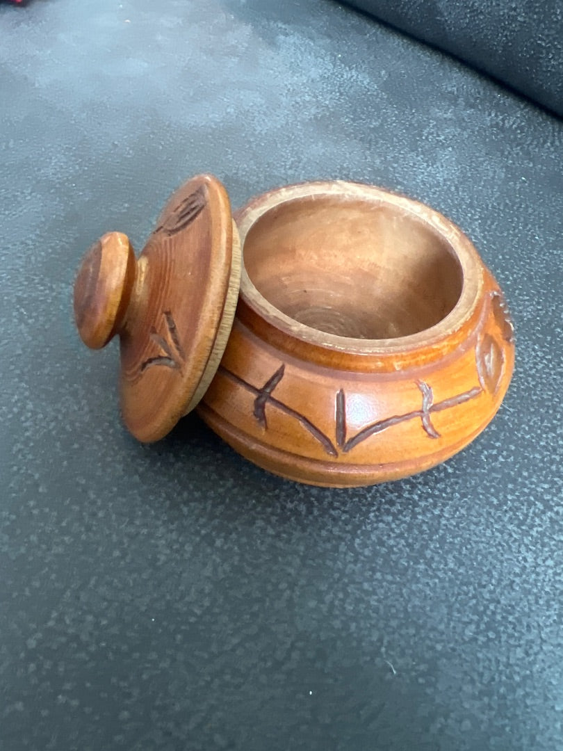 Hand-carved wooden trinket box with a matching lid