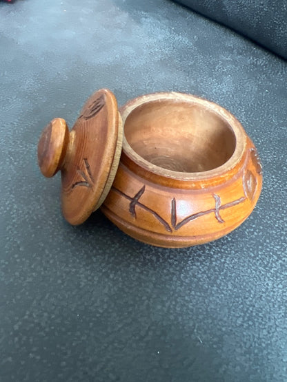 Hand-carved wooden trinket box with a matching lid