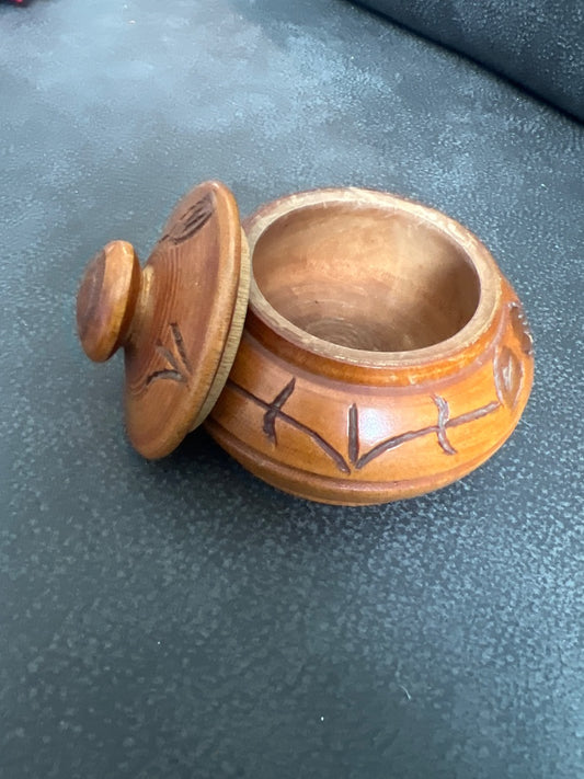 Hand-carved wooden trinket box with a matching lid