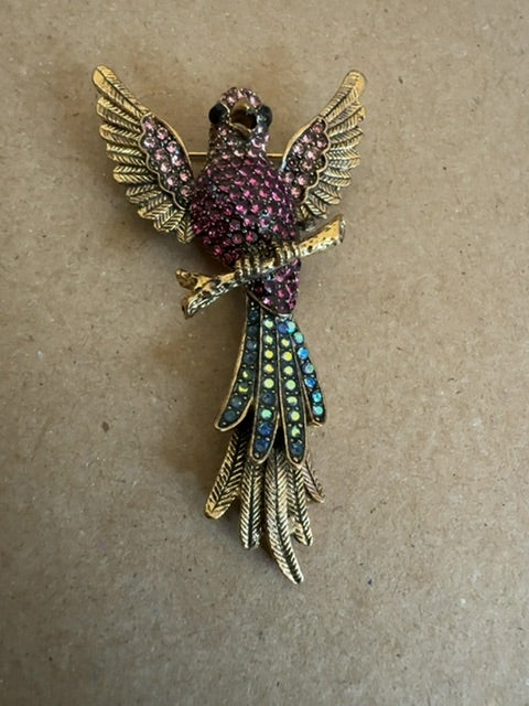 Bird dark pink blue gold tone brooch