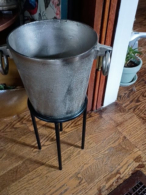 Heavy silver metal planter on stand