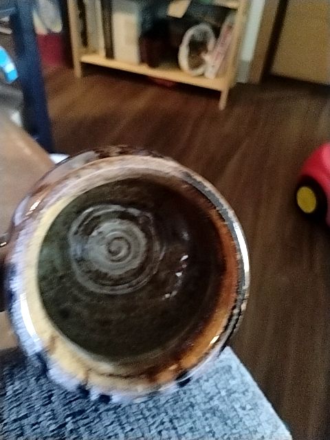 Brown, tand, with subtle hints of blue  Hand thrown pottery coffee mug