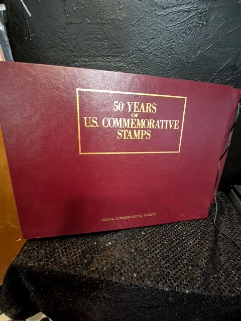 Burgandy United States Postal Service 50 Years of US Commemorative Stamps (2 Albums), 16" × 11.5"