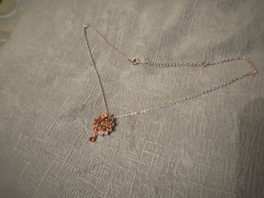 Multi, rose Unknown Rose gold tone setting with multi colored stones