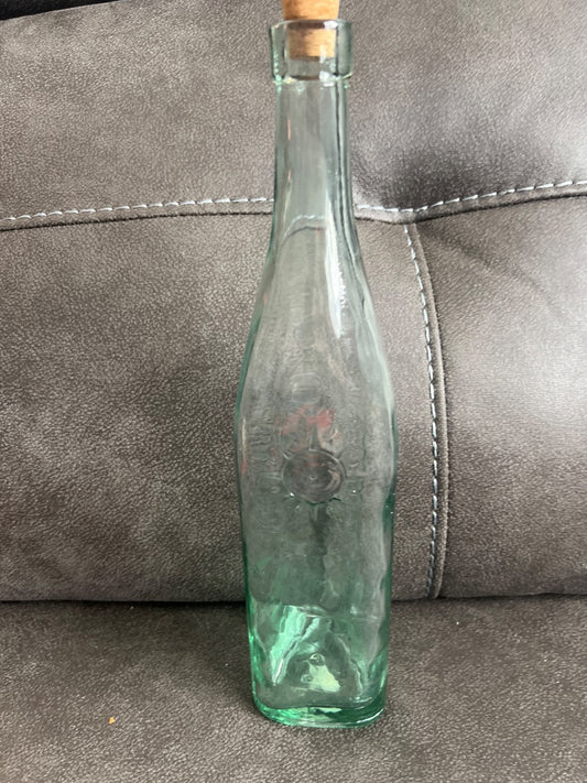 Decorative vintage-style green glass bottle