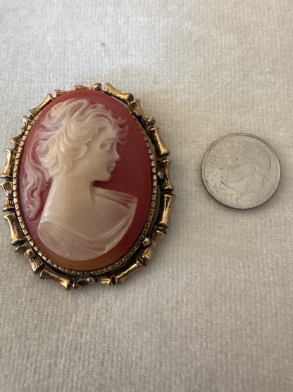 Cameo in gold bamboo frame.