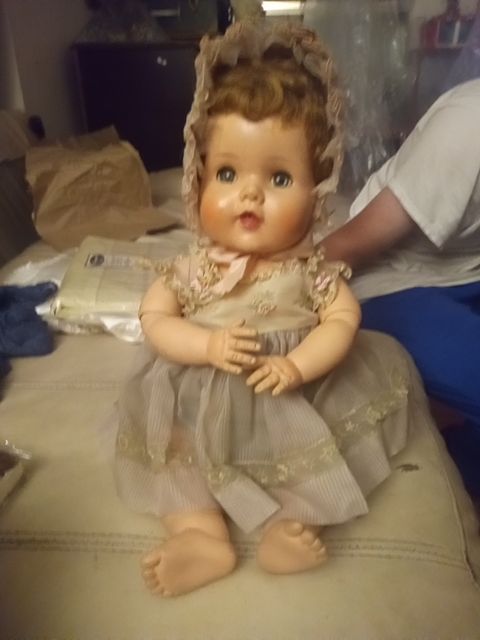 Antique articulated baby doll with clothes