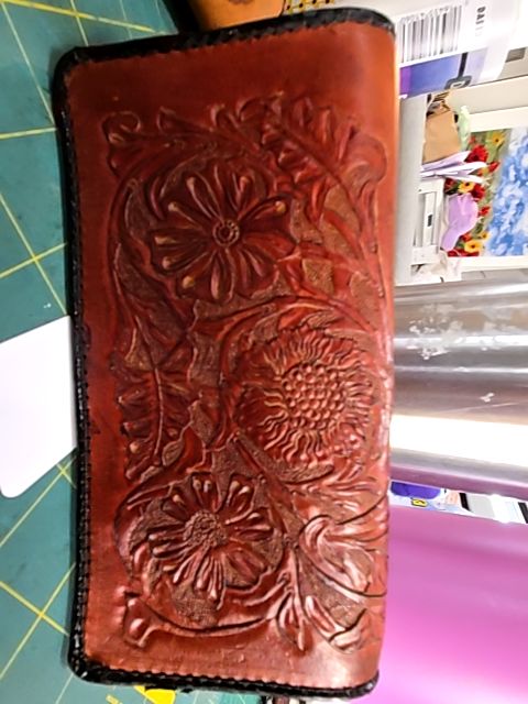Leather tooled checkbook cover