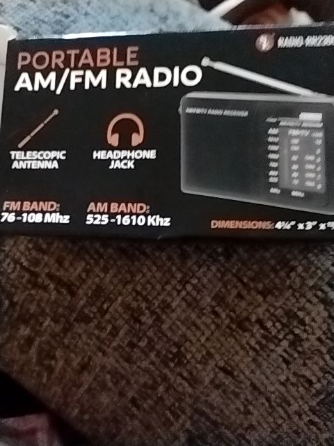 Black  Portable AM/FM Radio, 4 1/4" X 3" X 13/16"