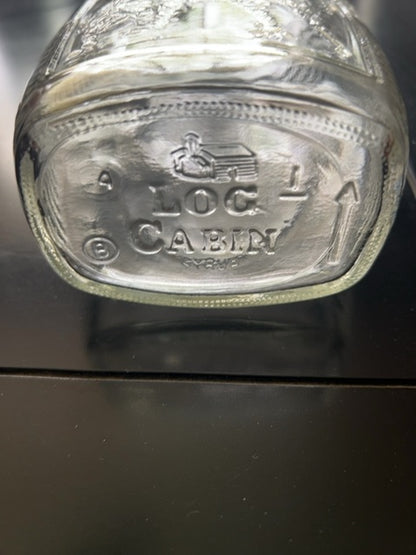 Vintage log cabin “drummer boy” bottle