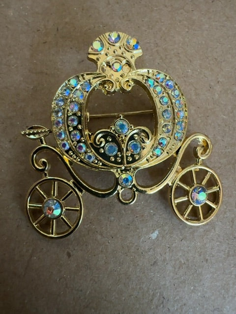 Cinderella like gold tone coach brooch