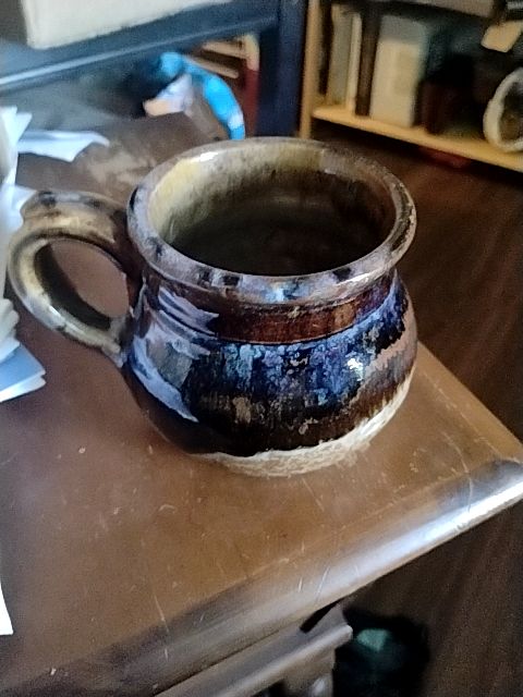 Brown, tand, with subtle hints of blue  Hand thrown pottery coffee mug