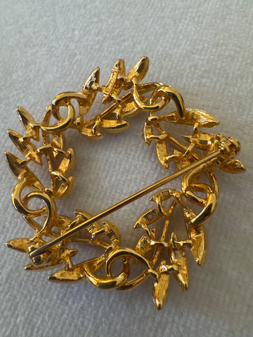 Circle, leaf, golden brooch