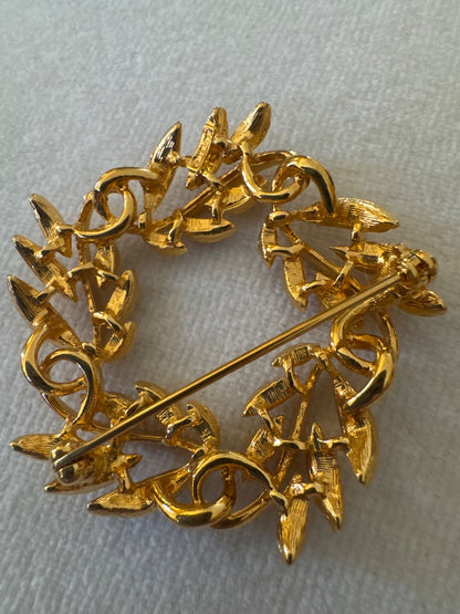 Circle, leaf, golden brooch