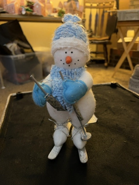 Blue skiing snowman