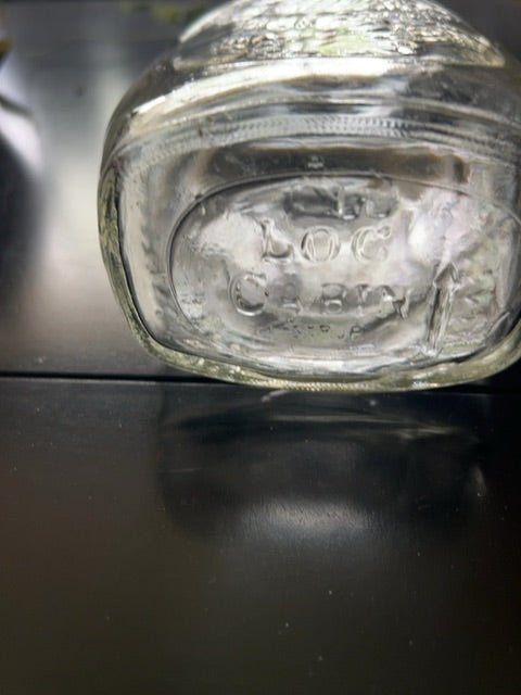 Vintage log cabin “Cornucopia “ bottle