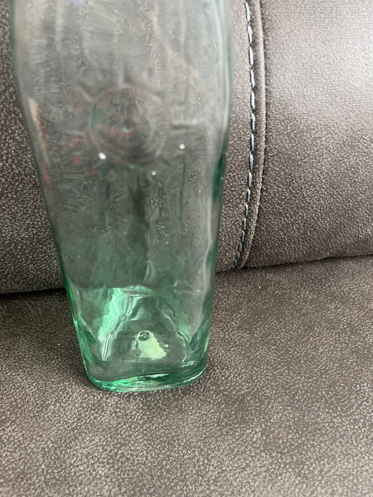 Decorative vintage-style green glass bottle