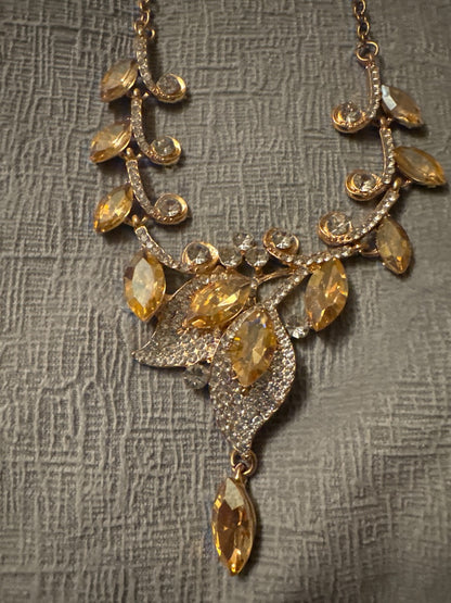 Yellow and gold stunning rhinestone necklace and earrings. Unknown Gold rhinestone set