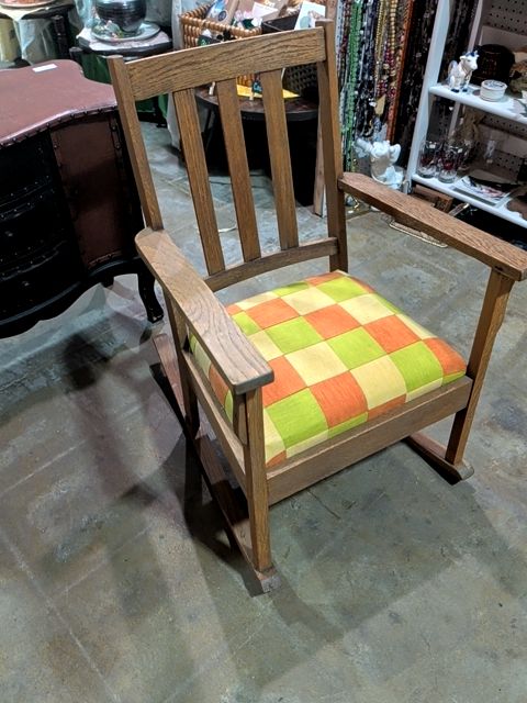 Rocking chair with plaid cushion