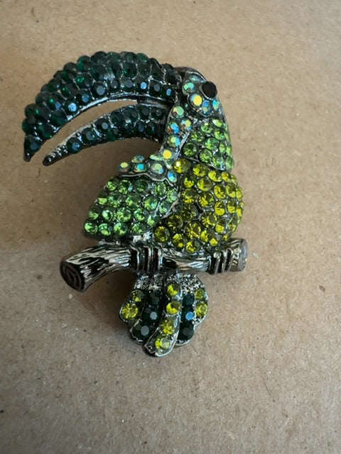 Green toucan brooch