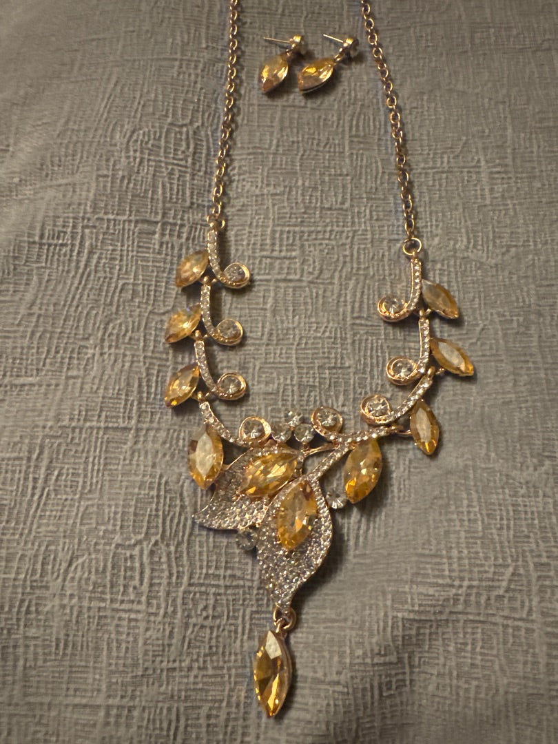 Yellow and gold stunning rhinestone necklace and earrings. Unknown Gold rhinestone set