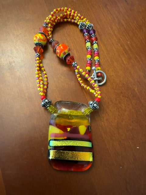 Glass yellow red bead and pendant necklace