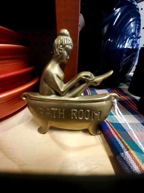 brass unbranded bath room sign