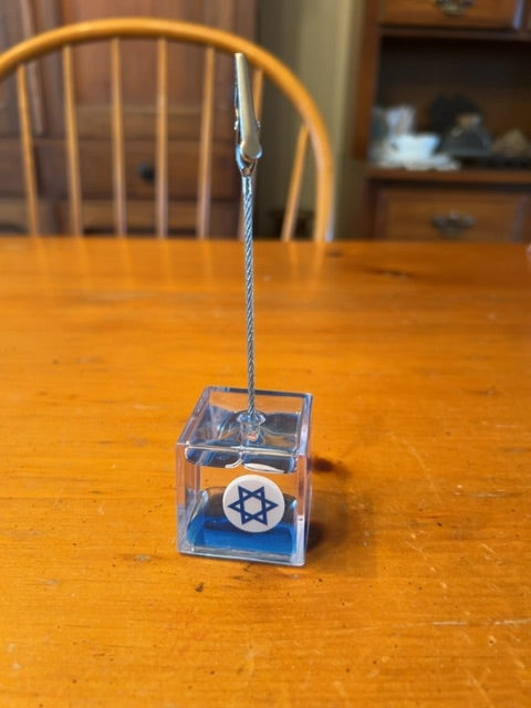 an acrylic liquid memo or note clip holder with a floating Star of David