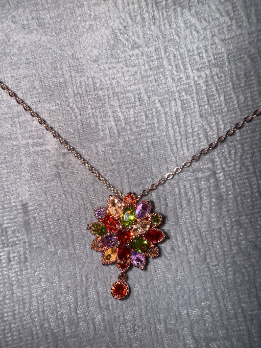 Multi, rose Unknown Rose gold tone setting with multi colored stones