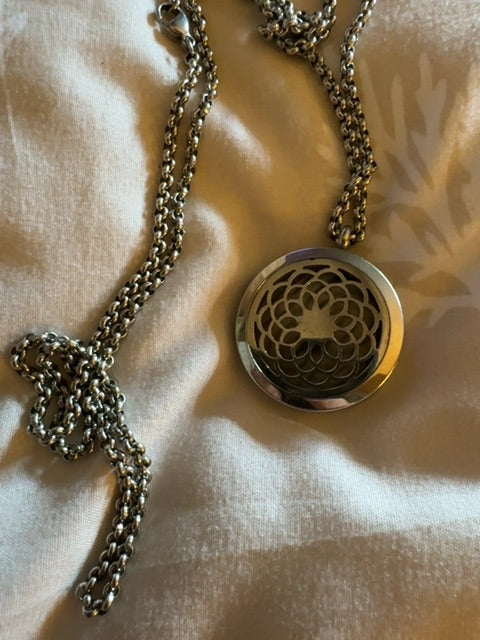 Silver tone flower aromatherapy necklace