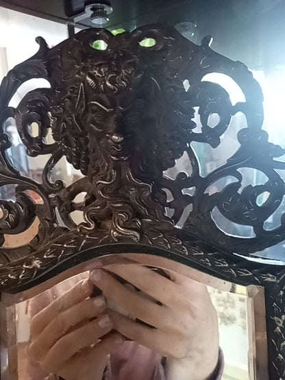 1880's piece of late-19th-century American craftsmanship: an antique Victorian Rococo Revival vanity mirror.