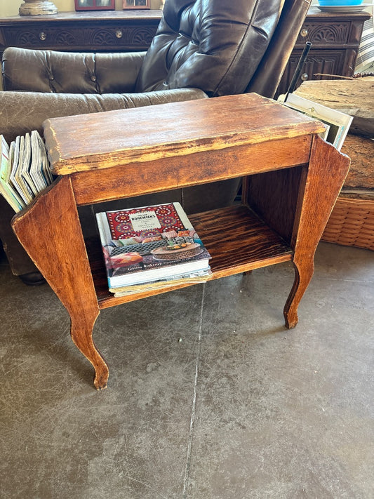 Brown  Magazine table, 26” w x 11” d x 22.5 tall