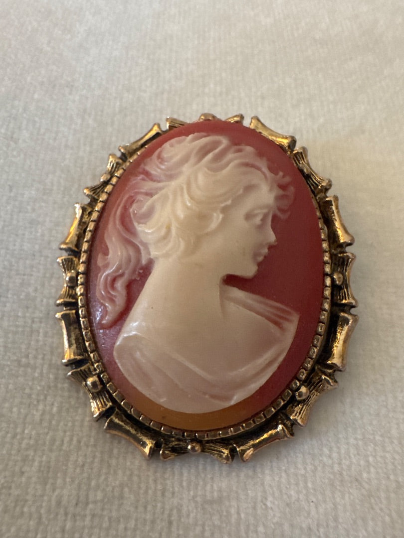 Cameo in gold bamboo frame.