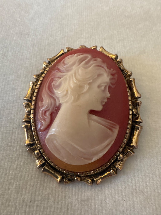 Cameo in gold bamboo frame.