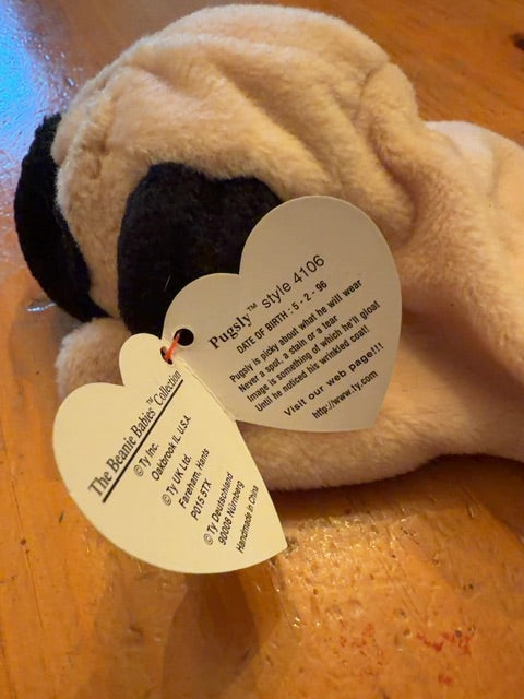 Beanie Baby Pugsly. Has paper tag.