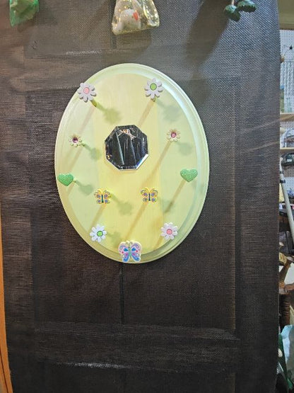 Yellow hanger with mirror