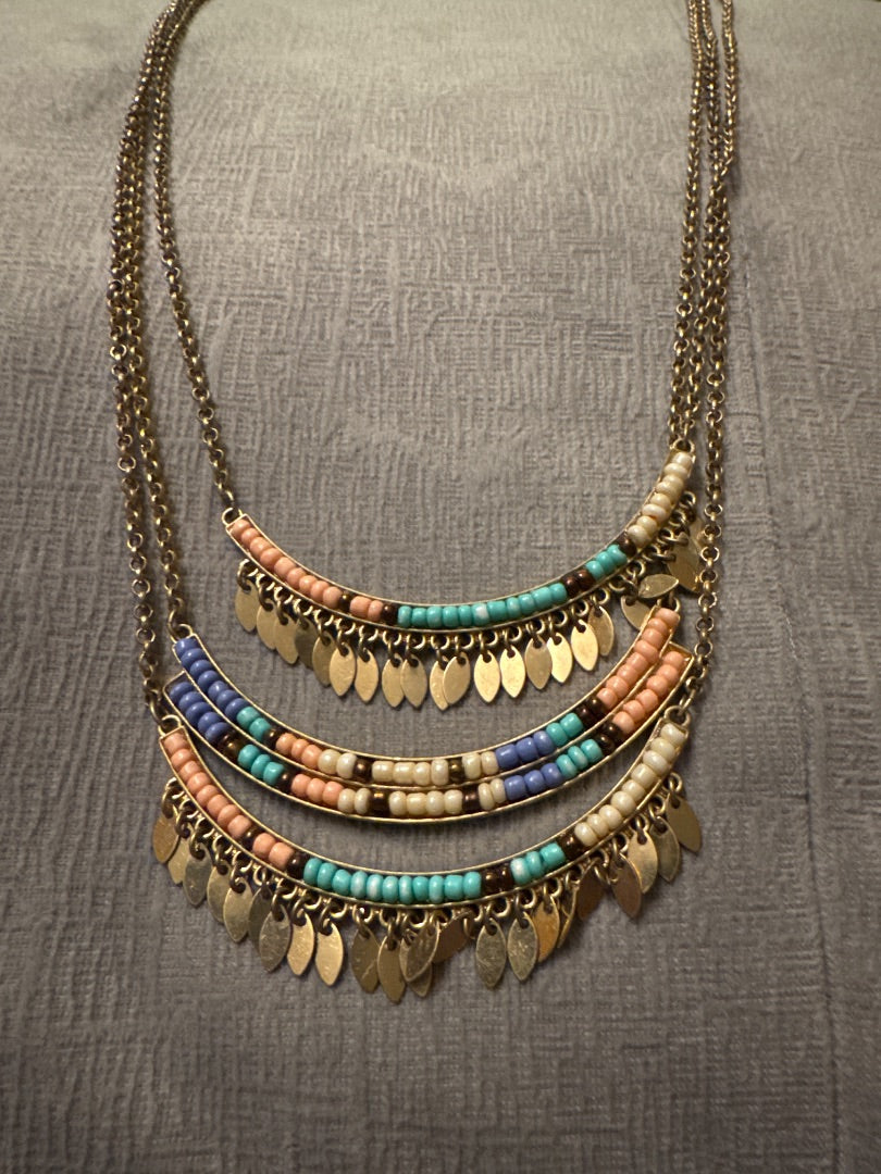 Gold tone setting, pastel beads Unknown Three bar, long, gold tone necklace