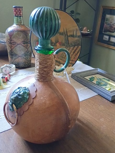 Brown leather bottle 7 x 11, green metal top