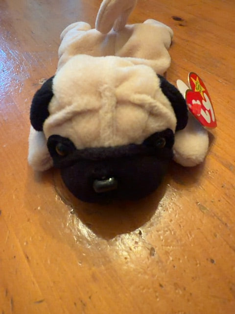 Beanie Baby Pugsly. Has paper tag.