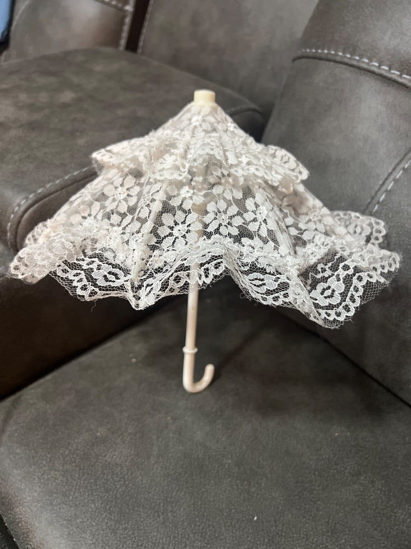 This decorative white lace mini parasol