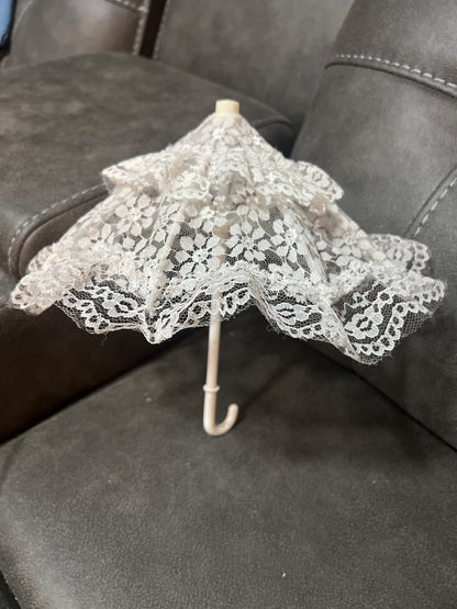 This decorative white lace mini parasol