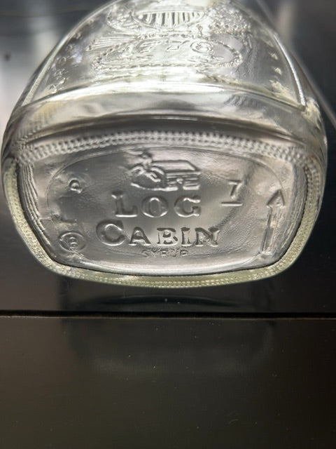 Vintage log cabin, “ bald eagle” bottle