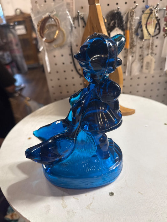 Blue glass figure with geese