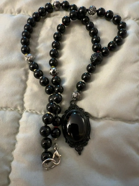 Dark red bead necklace with pendant
